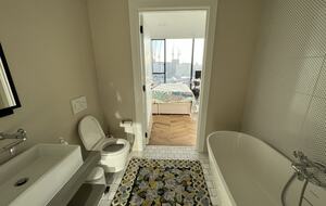 master bathroom with bath and shower