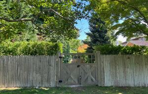 Landscaper gates closing off driveway from yard