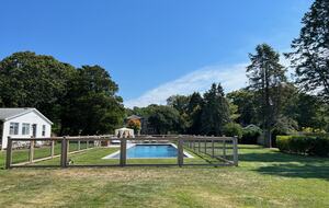 View of the pool, cottage and main house