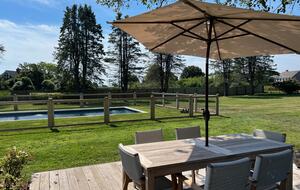 Cottage back deck overlooking pool and farm