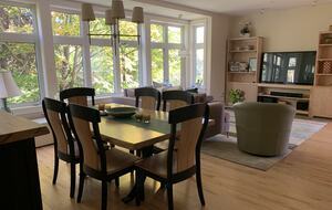 great room with dining, living room and large tv