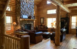 Living area with river rock fireplace