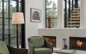 Family Room with fireplace and open stairway.
