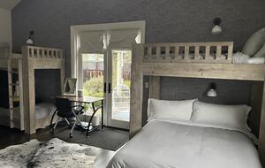 Bunk room with it's own adjoining patio and rose garden.