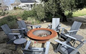 The second fire-pit, adjacent to the bocce and trampoline.
