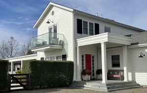 The front porch and deck off of the principal bedroom.