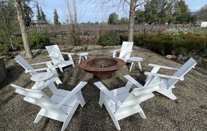 The first of 2 fire-pits, adjacent to outdoor dining table.