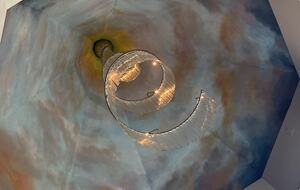 ceiling in primary bedroom featuring an original Vavini chandelier