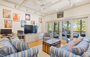 Lower level Family room with view of lower deck seating area