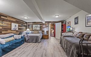 Lower level bedroom with queen bed and trundle bed(2 single beds)