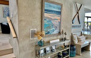 At entrance with living room above and dining room at right.