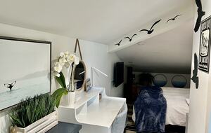 Entrance to guest suite with low sloped ceilings.