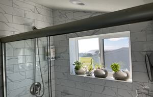 View from detached bedroom en-suite bathroom shower.