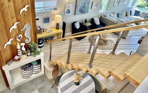 Looking from landing to stairs and living room.