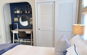 Desk and closet area with Fall/Winter bedding.