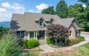 The house sits below street level which and is oriented to the back