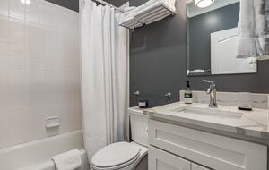 Upstairs hallway bath that supports upstairs queen too