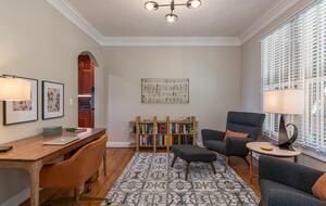 Upstairs sitting room off kitchen with desk -- not enclosed