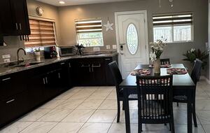 Kitchen with table that pulls out and extends to sit 8