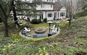 View from the upper lawn with fire pit and terraces