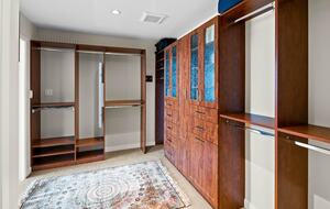 Walk in closet with folding mirror