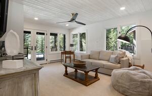 downstairs living area with pull-out sofa, SMART TV, patio