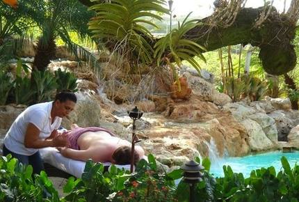 Enjoy a massage by the pool fountain