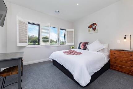 King sized bed overlooking the orchard