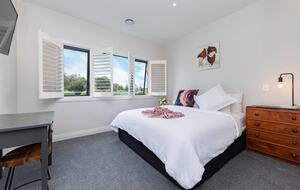 King sized bed overlooking the orchard