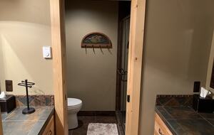 Downstairs bathroom with double vanities