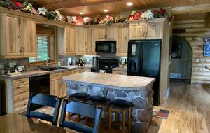 Kitchen with appliances, spice rack, blender, coffee maker