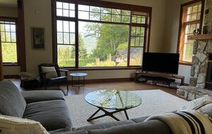 Living room with fireplace and view of the mountain