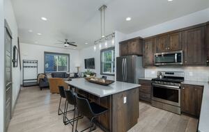 Kitchen island has additional seating for three