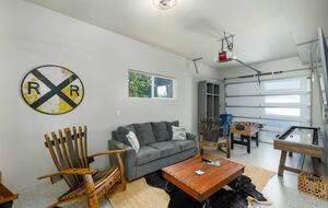 Garage is a game room with another TV area