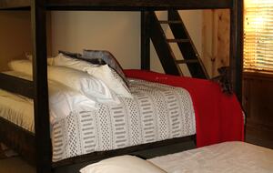 Queen on bottom, Full XL on top, Twin trundle underneath.