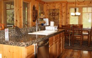 Kitchen island into dining room.