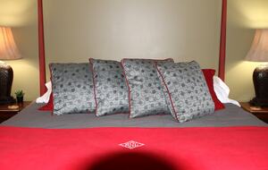 Comfortable king bed with extra blankets.