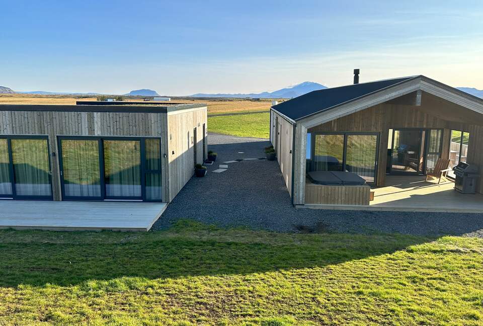 View over the main house and guest house seen from between