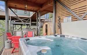 Outdoor kitchen, barrel sauna, fire pit and hot tub.