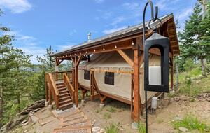 The Glamping Tent is a just a short walk from the treehouse.