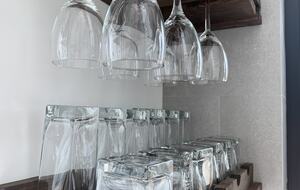 fully stocked kitchen with cutlery/cookware/plates/bowls/glasses
