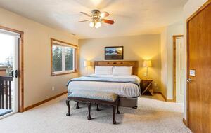 The master bedroom features a small balcony and an office area