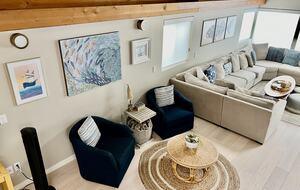 Looking down from stairs into living room.