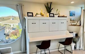 Landing area with desk which becomes full size Murphy bed.