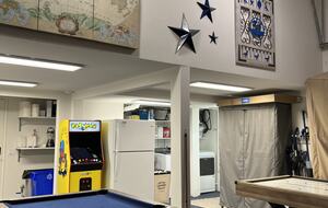 Pool table, air hockey table and PAC-Man arcade game.