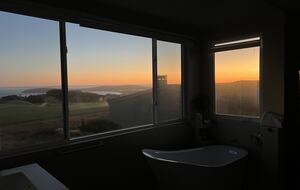 Primary bathroom at sunset.