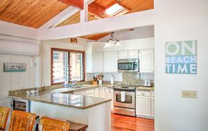 Fully stocked kitchen w/ sub-zero fridge and sub-zero wine fridge.