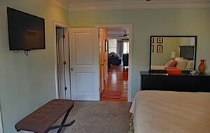 First Floor Master Bedroom with TV, Full Bath, Dresser and Private Dec