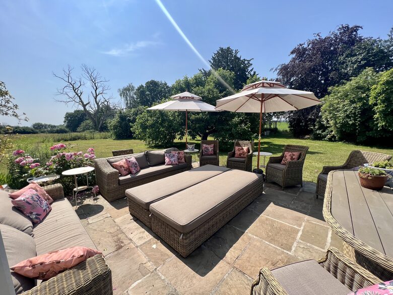 Garden Terrace with table & sofas - garden & meadow views