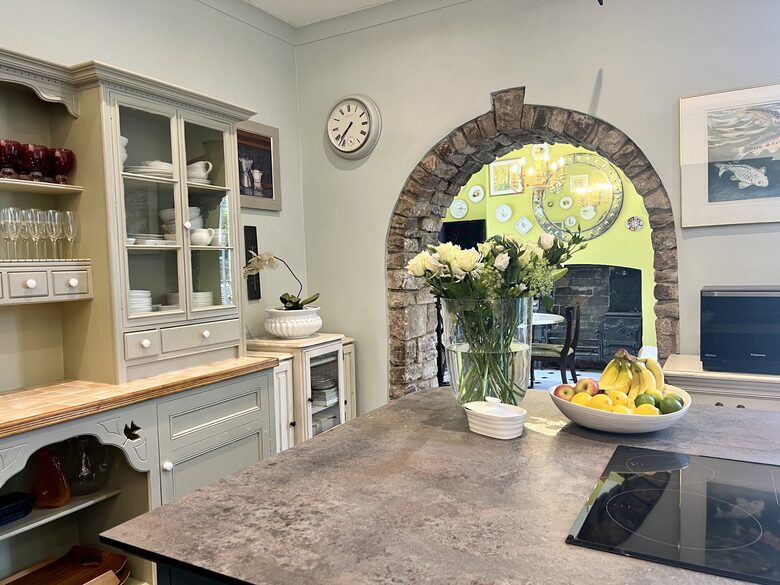 Kitchen open plan to breakfast room with table and sofa